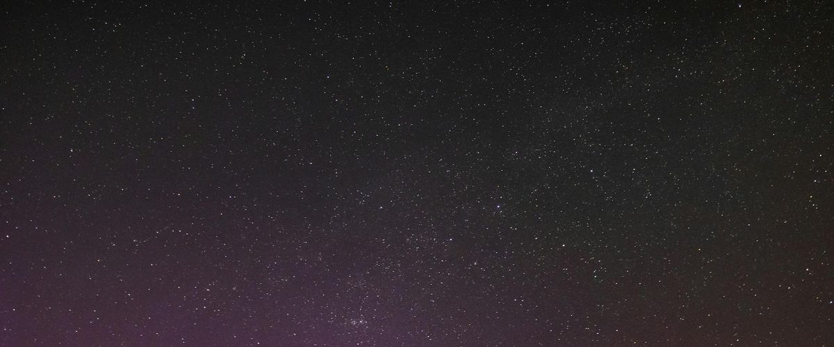 Ethereal pink fog over dark background representing universal practice